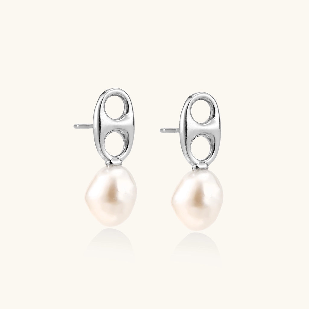 Sterling silver oval stud earrings with dual circular cutouts and suspended freshwater pearls on white background.