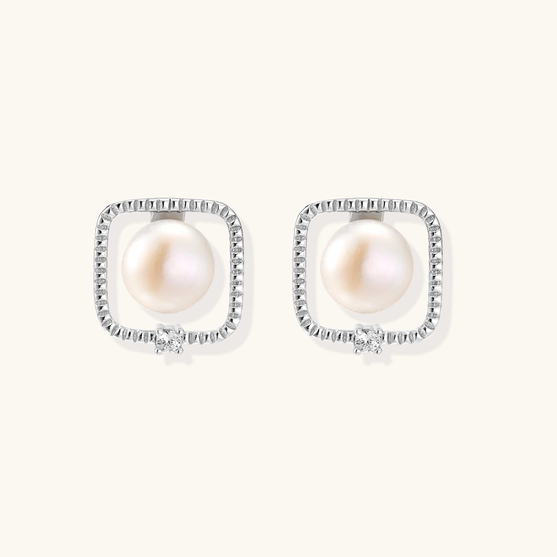 Square sterling silver stud earrings with freshwater pearls and crystal accents on white background.