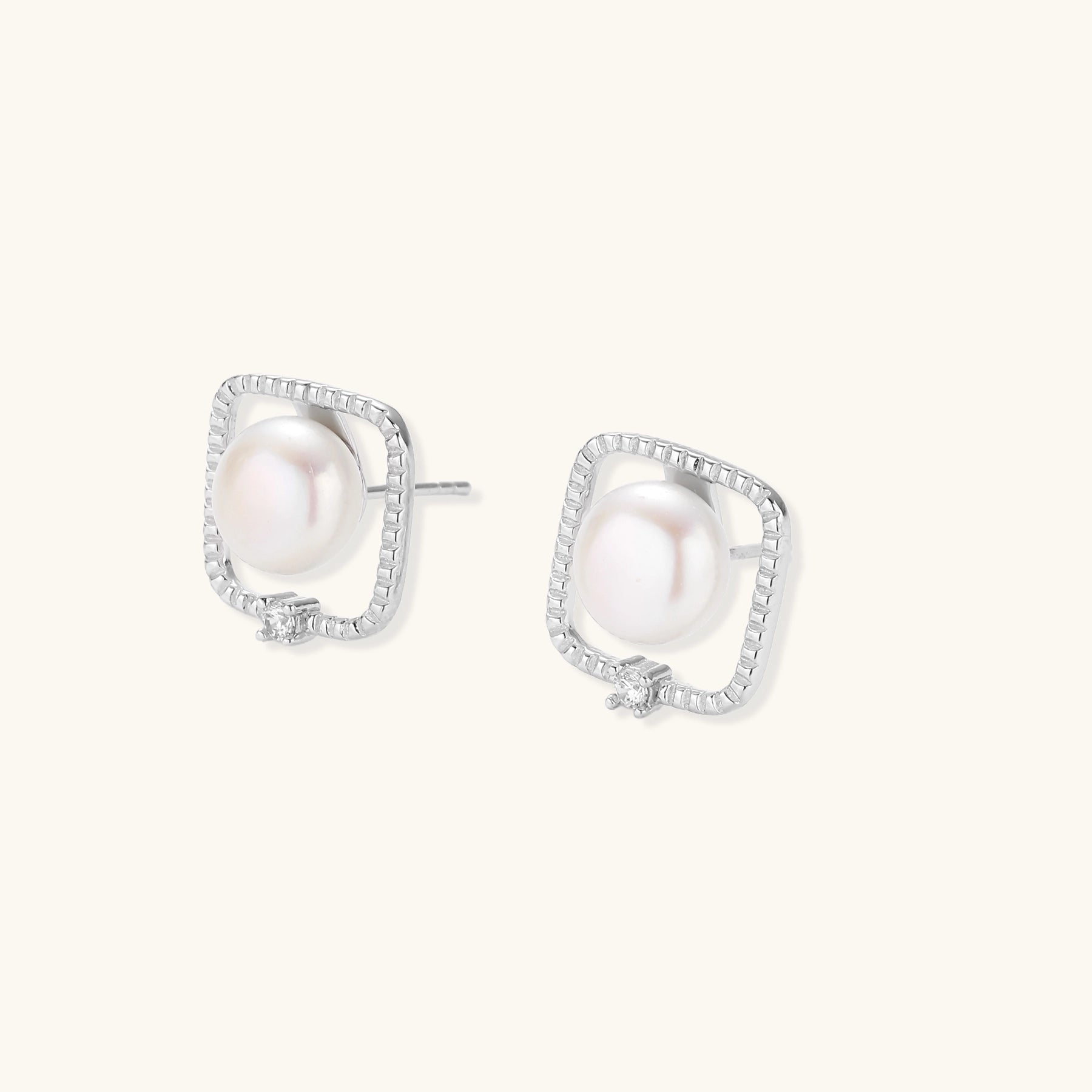Square sterling silver stud earrings with freshwater pearls and crystal accents on white background.