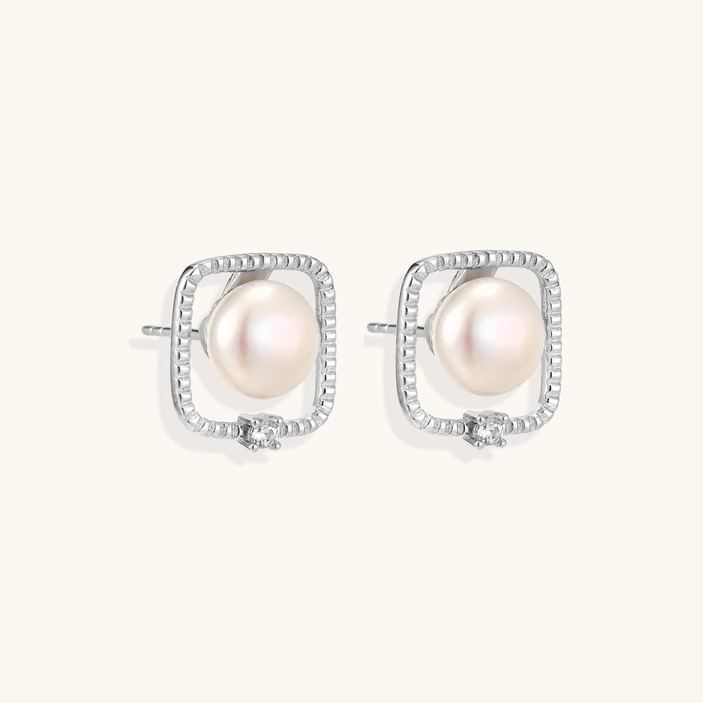 Square sterling silver stud earrings with freshwater pearls and crystal accents on white background.