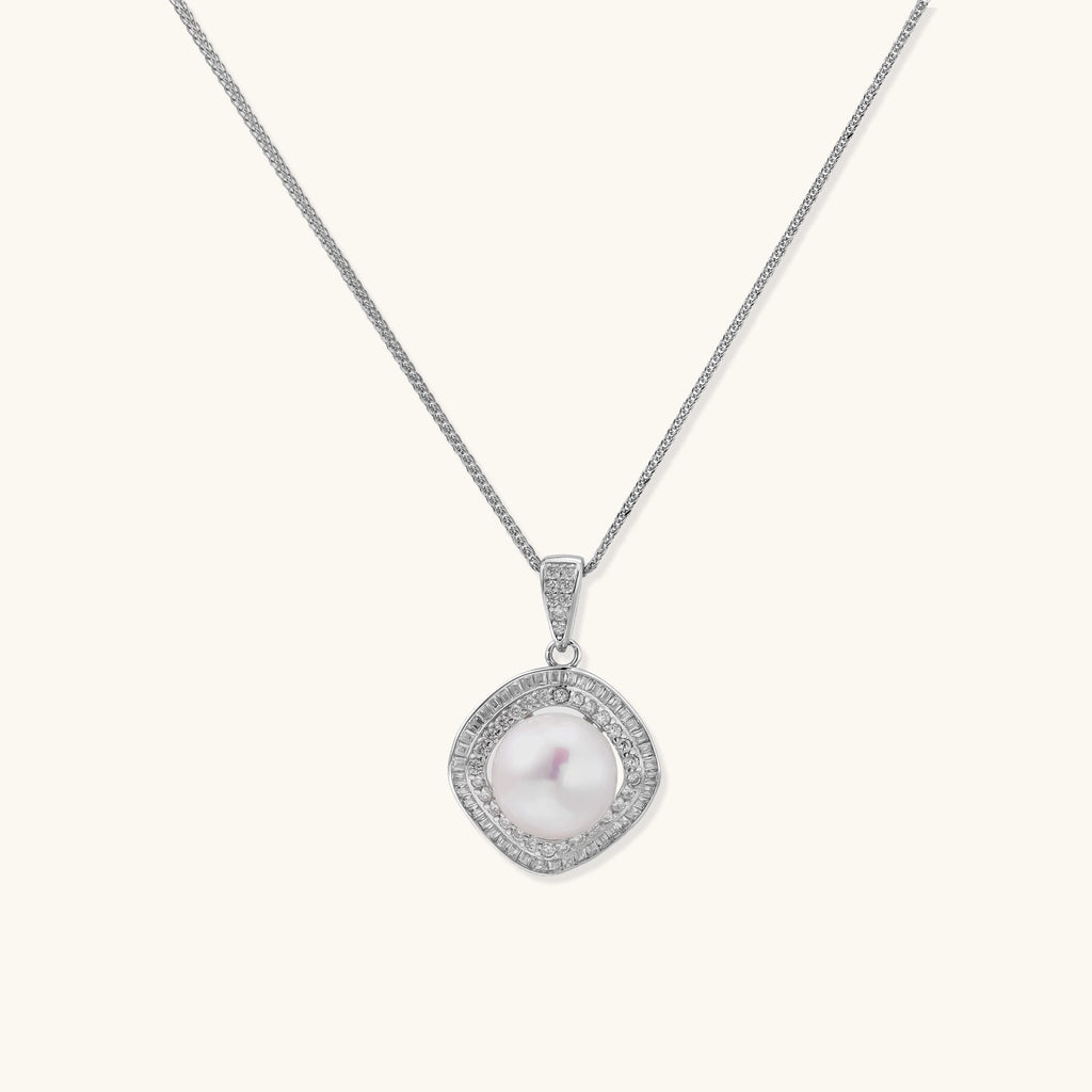 Sterling silver necklace with geometric halo setting surrounding a 10mm freshwater pearl on white background.