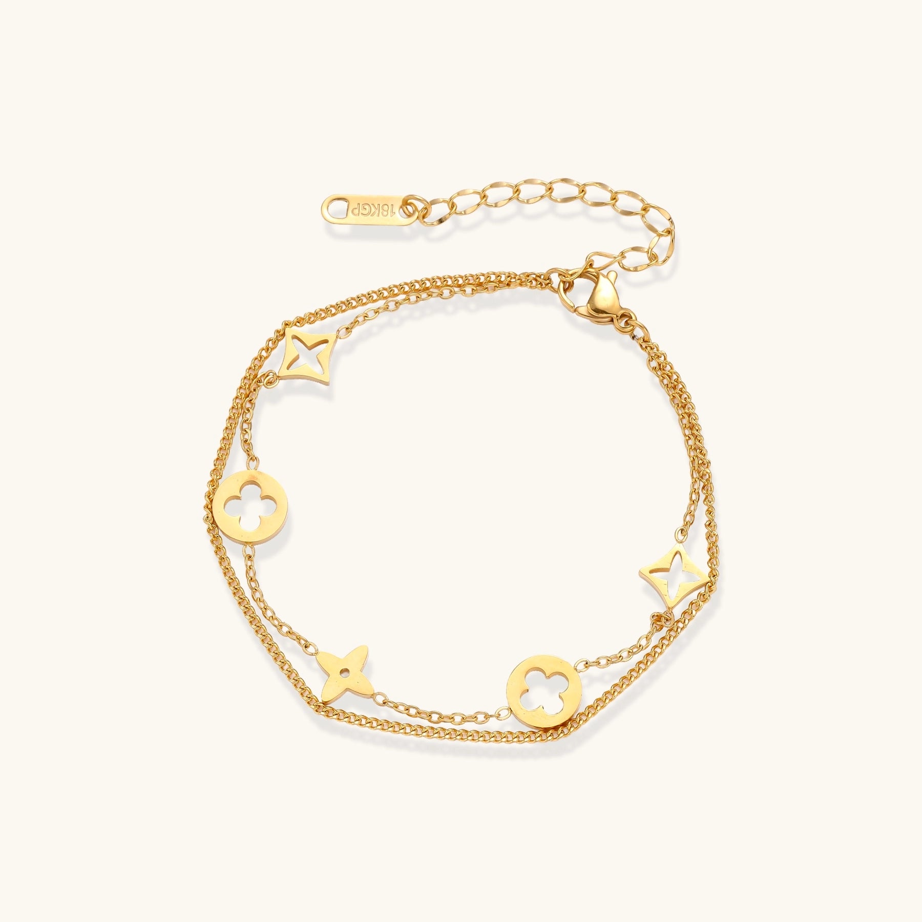Dainty gold-plated bracelet with star and clover charms on double chain with adjustable extender