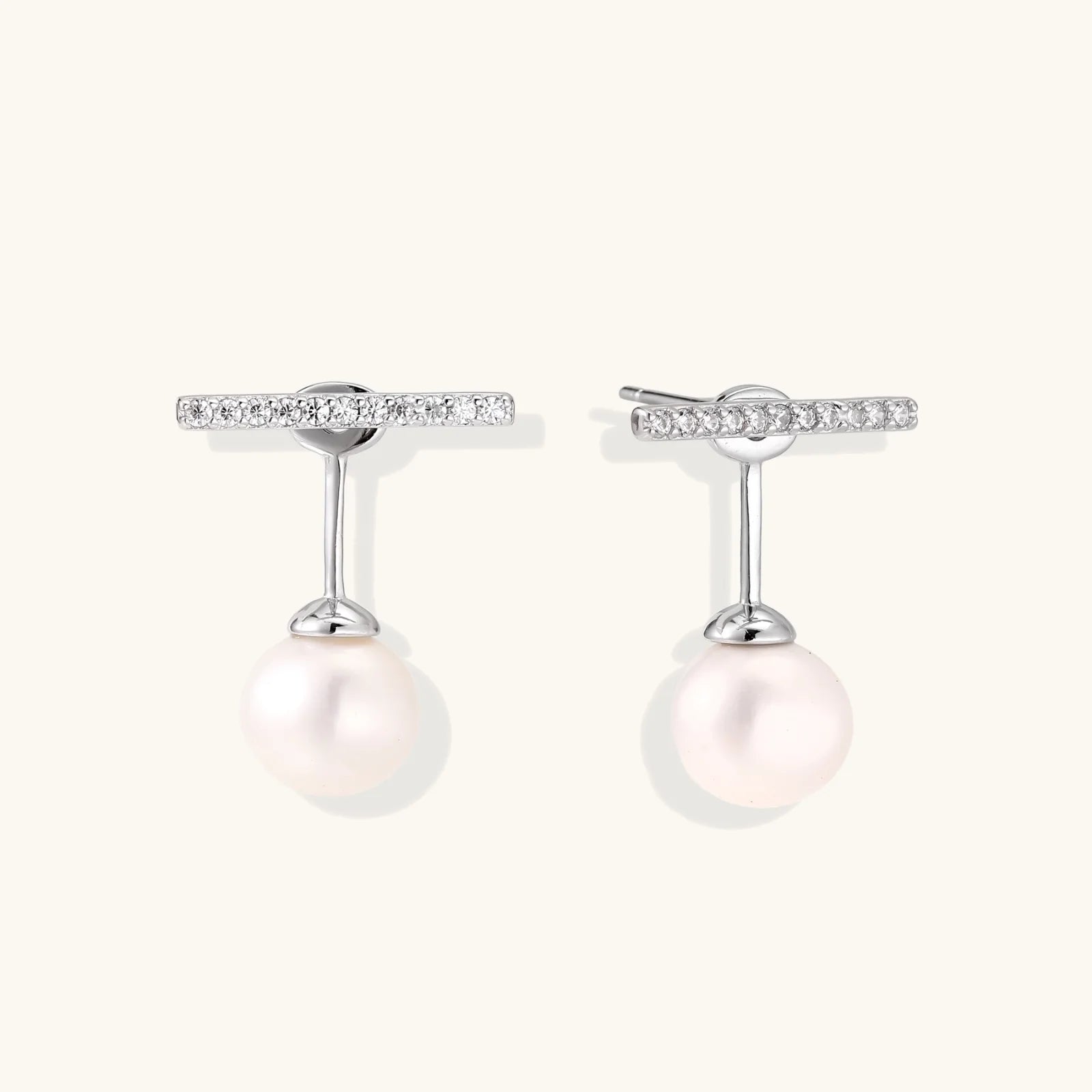 Rhodium-plated sterling silver ear jacket earrings with diamond-set horizontal bar and freshwater pearl drop