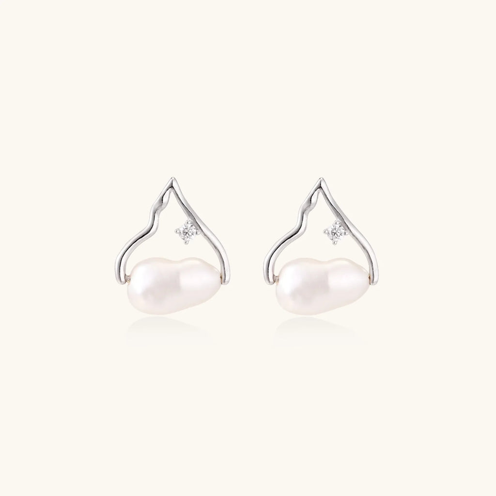 Silver mountain outline studs with baroque pearl and diamond accent on white background