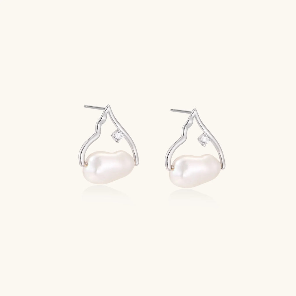 Silver mountain outline studs with baroque pearl and diamond accent on white background