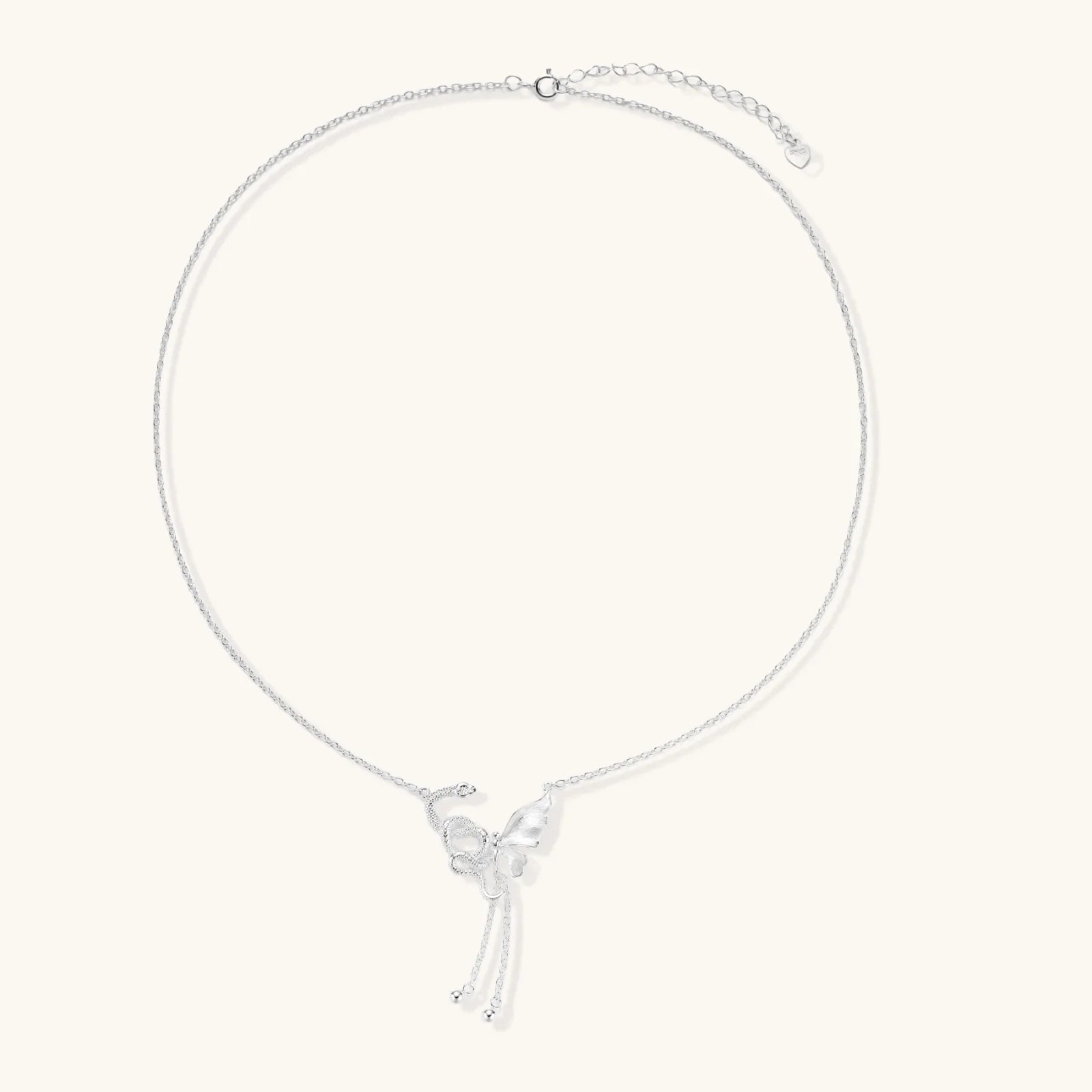 Sterling silver butterfly pendant with textured wing detail on adjustable Y-chain with ball drop ends